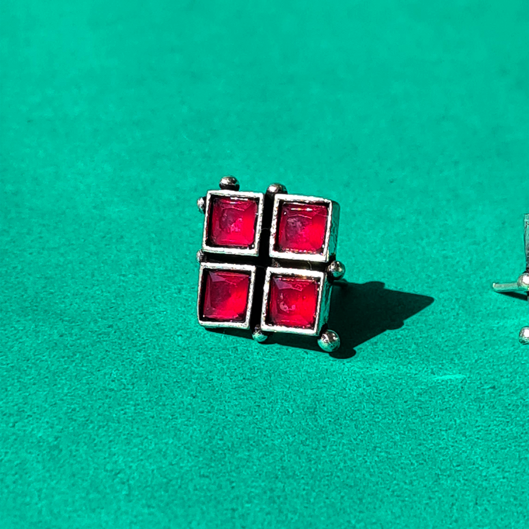 WHISPERING RED STUDS